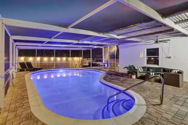 a view of a swimming pool with chairs