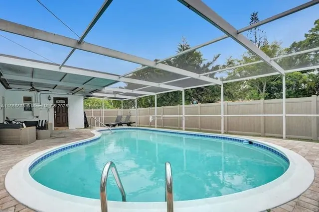 a view of a swimming pool with a patio
