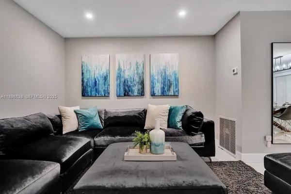 a living room with furniture and a couch