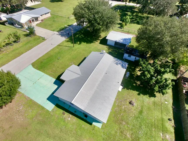 an aerial view of a house with swimming pool