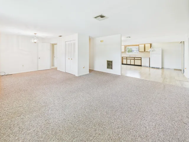 a view of a livingroom with wooden floor
