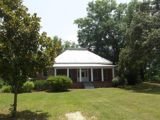 5500 Sardis Church Road Macon, GA 31216 - Photo 1 of 10 a front view of a house with a garden