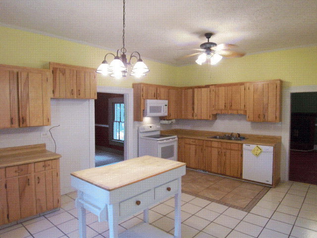 5500 Sardis Church Road Macon, GA 31216 - Photo 2 of 10 a kitchen with granite countertop stainless steel appliances a sink cabinets and counter space