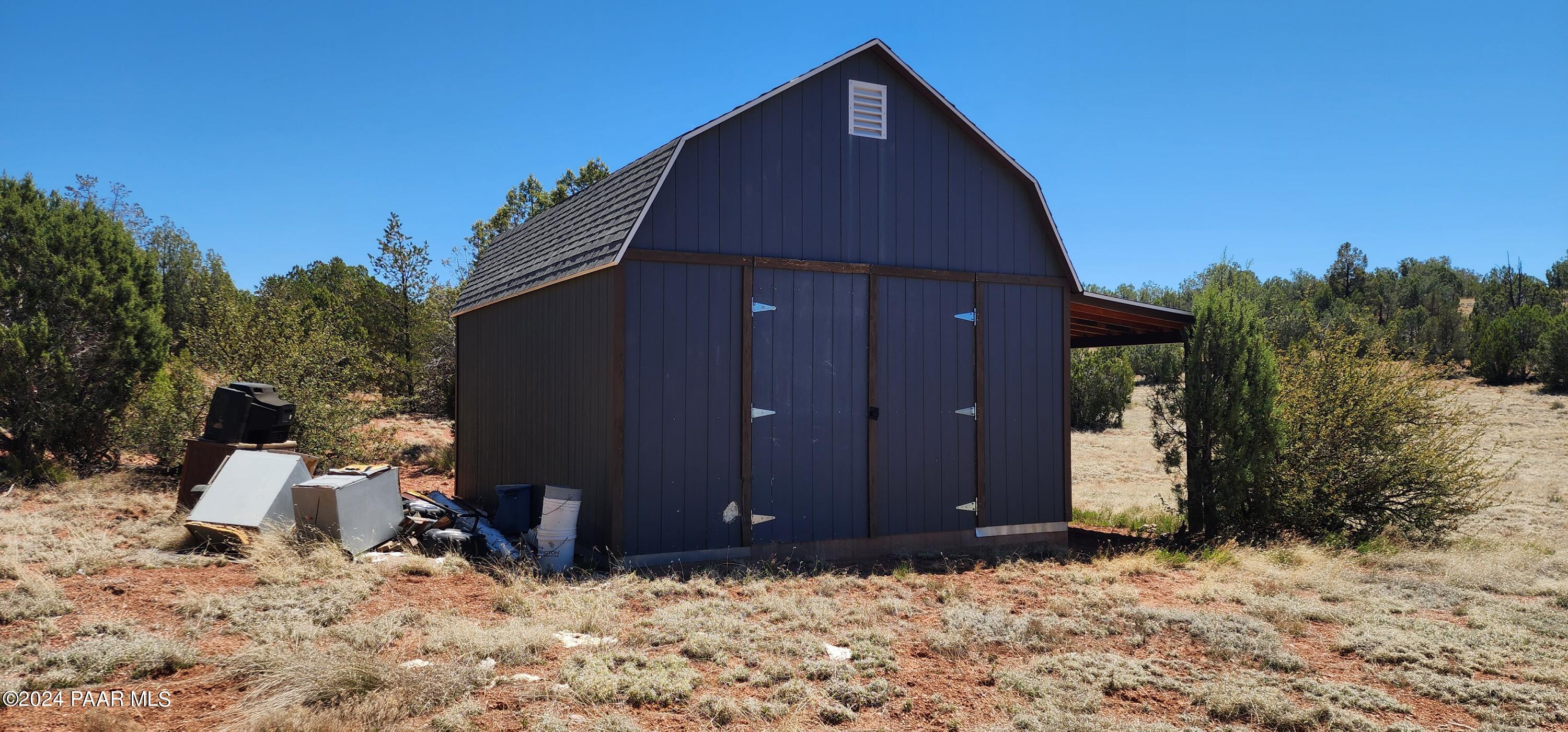 0 Wooden Ear Ranch Road Seligman, AZ 86337 - Photo 15 of 47 a backyard of a house with yard and tree