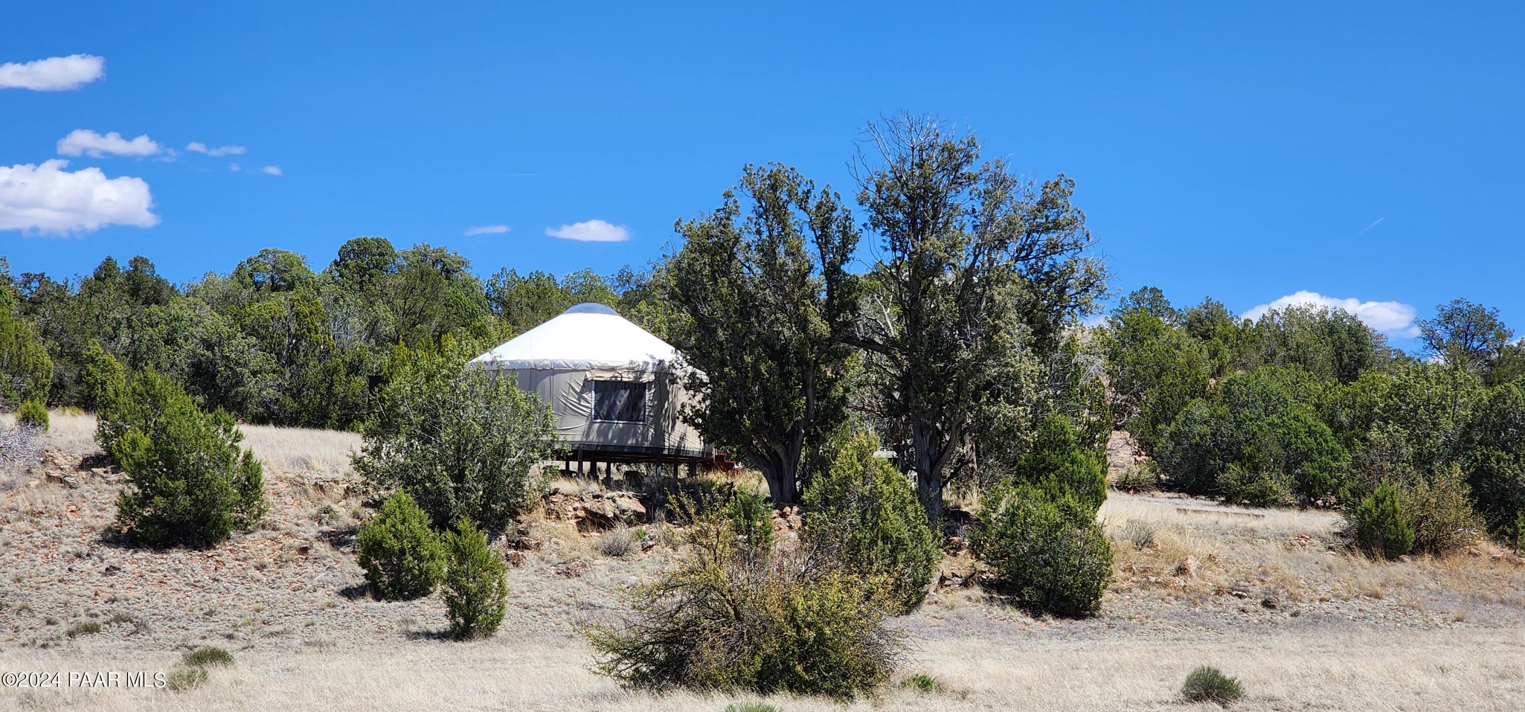 0 Wooden Ear Ranch Road Seligman, AZ 86337 - Photo 10 of 47 a view of a garden with a building in the background
