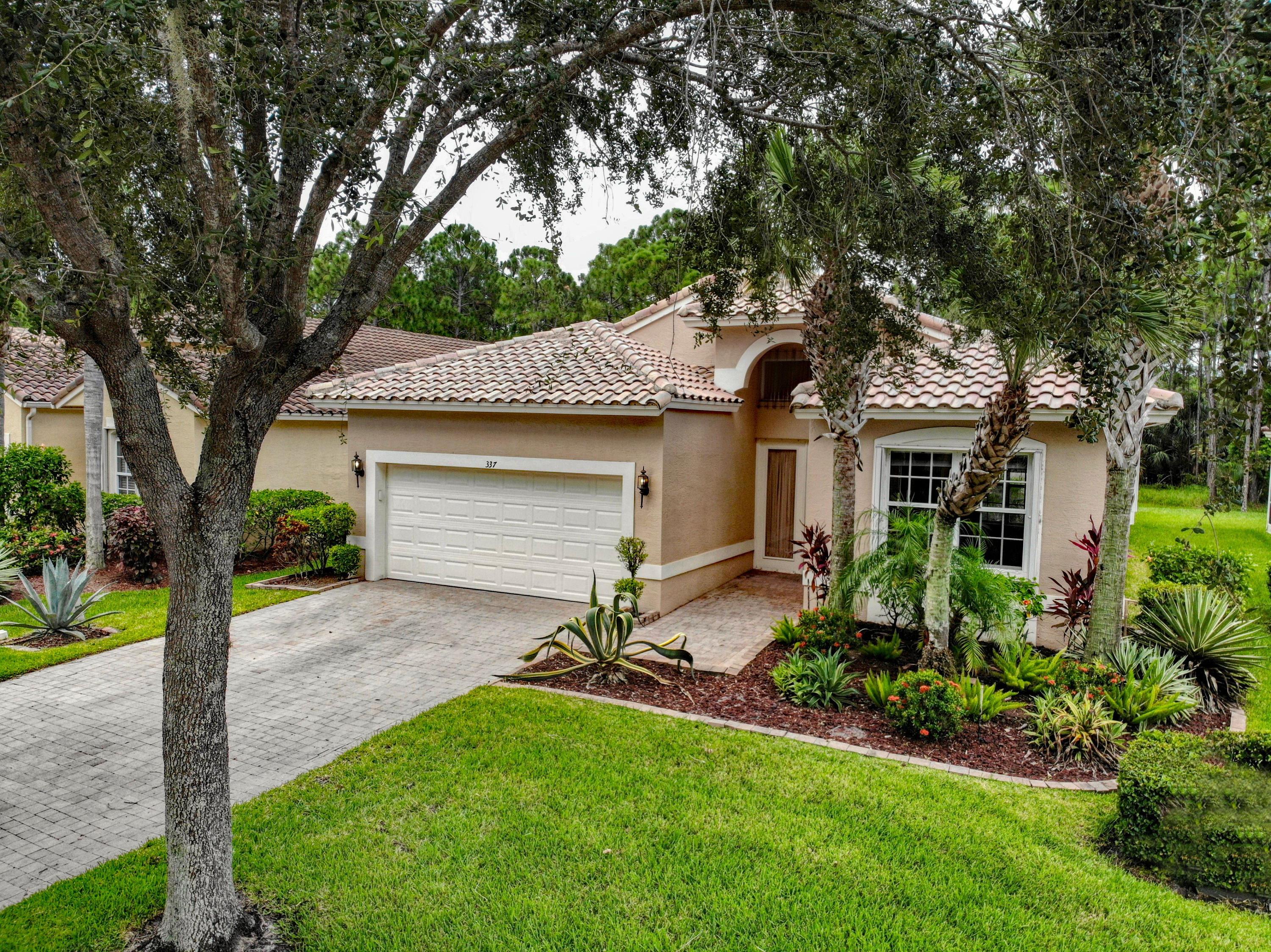 337 Springview Loop Port St. Lucie, FL 34986 - Photo 5 of 48 Front Quarter Low Alt. Angle