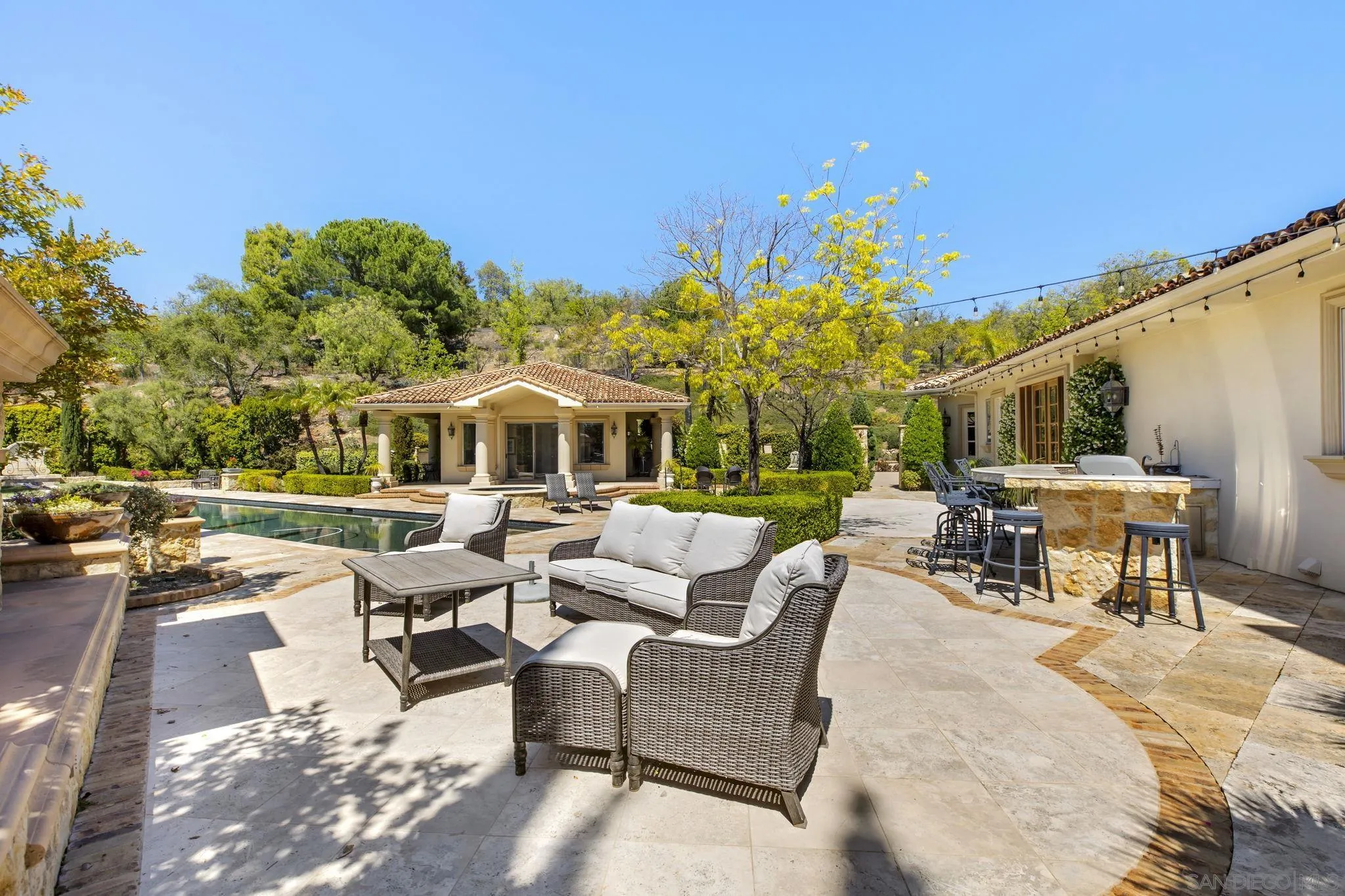 14440 Ridge Ranch Road Valley Center, CA 92082 - Photo 67 of 73 a view of a patio with couches table and chairs and potted plants