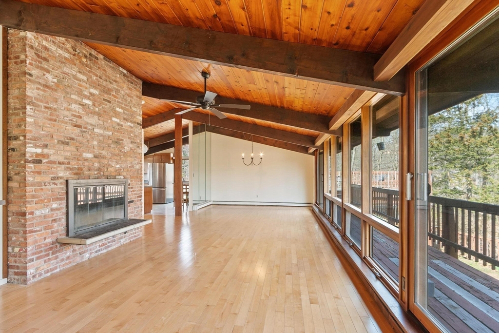 21 Gray Road Andover, MA 01810 - Photo 11 of 38 a view of a porch with wooden floor and windows