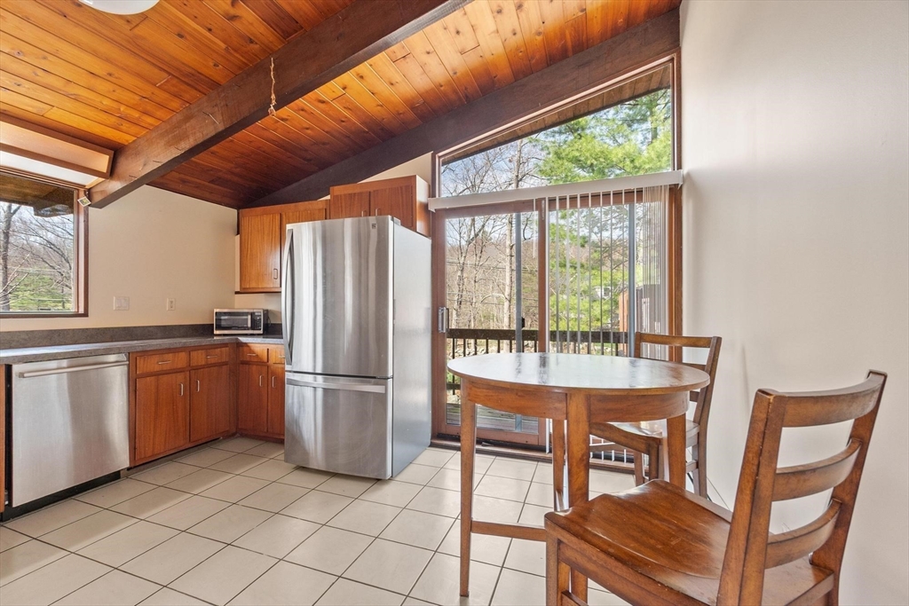 21 Gray Road Andover, MA 01810 - Photo 12 of 38 a kitchen with a table chairs and entryway