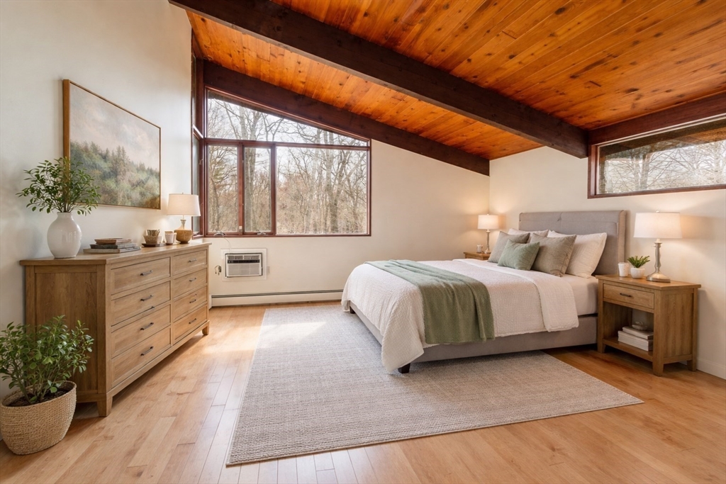 21 Gray Road Andover, MA 01810 - Photo 15 of 38 a spacious bedroom with a large bed and a potted plant