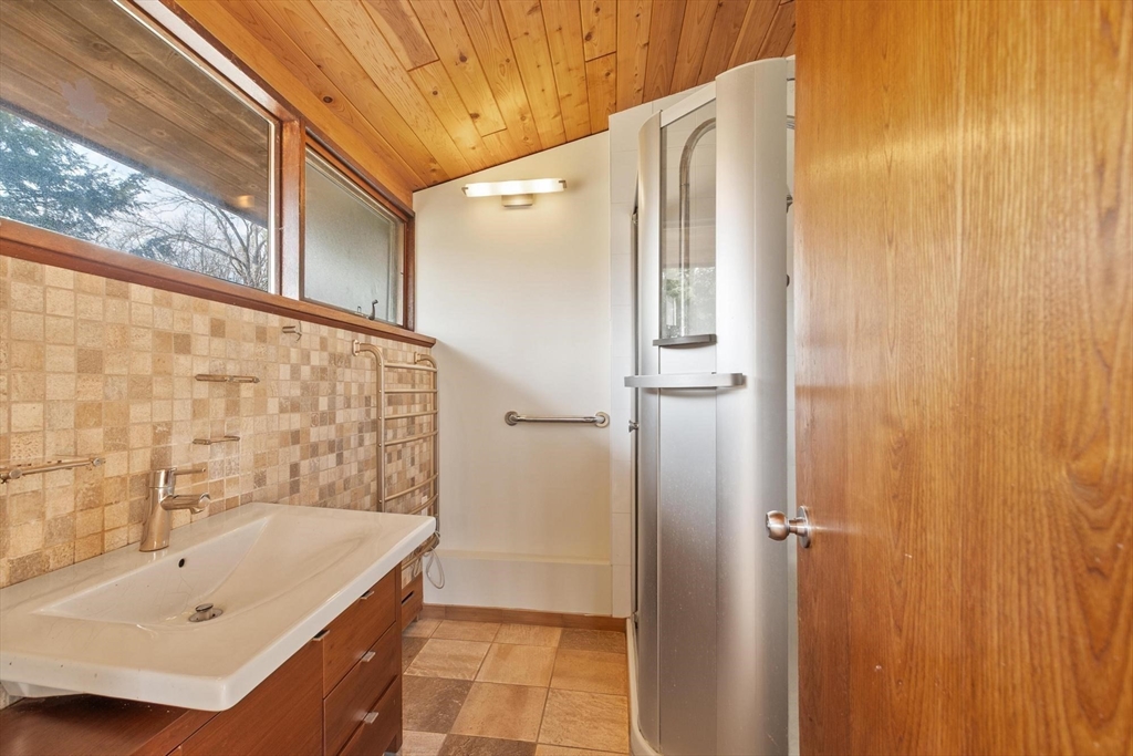 21 Gray Road Andover, MA 01810 - Photo 18 of 38 a bathroom with a tub and a shower