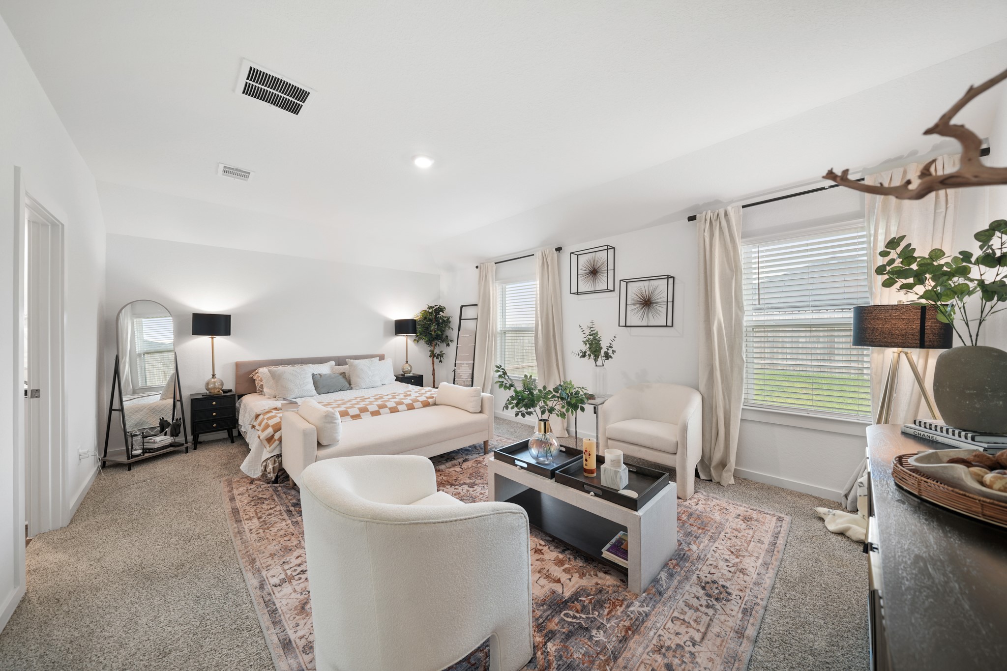 8918 Century Plant Lane Rosharon, TX 77583 - Photo 14 of 19 Generously sized primary bedroom featuring plush carpeting, recessed lighting, multiple windows, and space for a sitting area.
