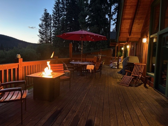 353 Blue River Road Blue River, CO 80424 - Photo 7 of 48 an outdoor sitting area with wooden floors and outdoor seating