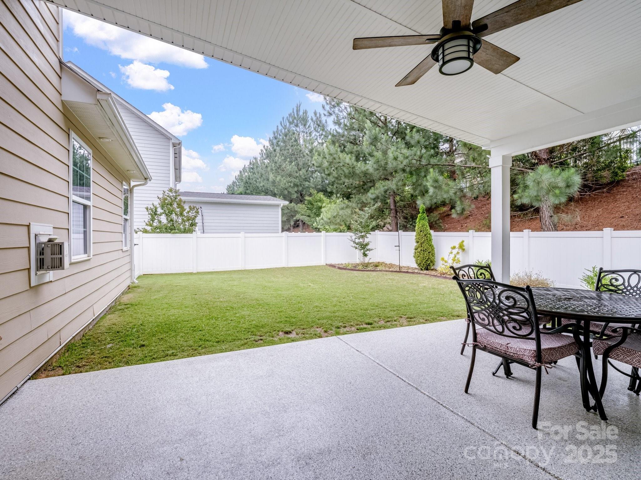 1033 Crawford Drive Lancaster, SC 29720 - Photo 41 of 48 a view of a patio with a table and chairs under an umbrella