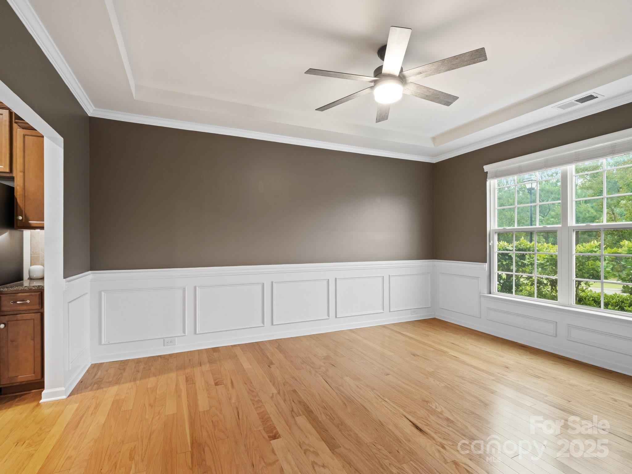 1033 Crawford Drive Lancaster, SC 29720 - Photo 9 of 48 a view of an empty room with a window and a ceiling fan