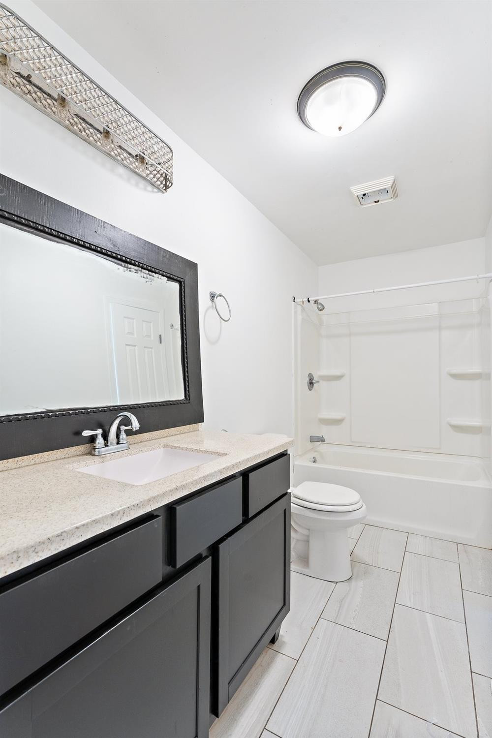10983 Potomac Drive Demotte, IN 46310 - Photo 8 of 18 a bathroom with a granite countertop sink mirror vanity and toilet
