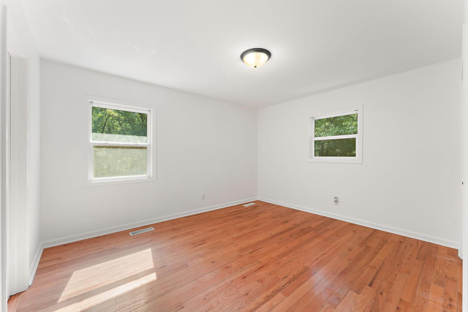 10983 Potomac Drive Demotte, IN 46310 - Photo 10 of 18 a view of empty room with wooden floor