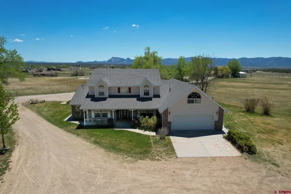 an aerial view of a house with lake view