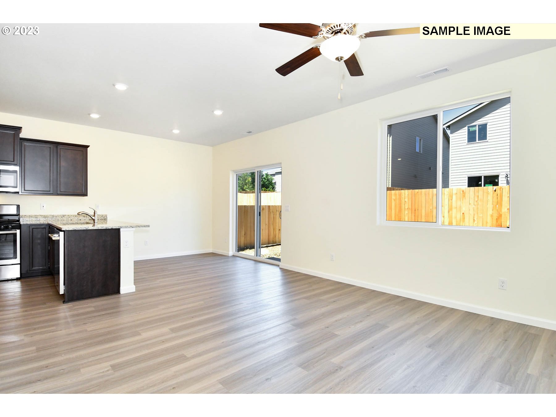 3974 Southwest Knapp Drive Gresham, OR 97080 - Photo 12 of 14 a view of an empty room with wooden floor and a window