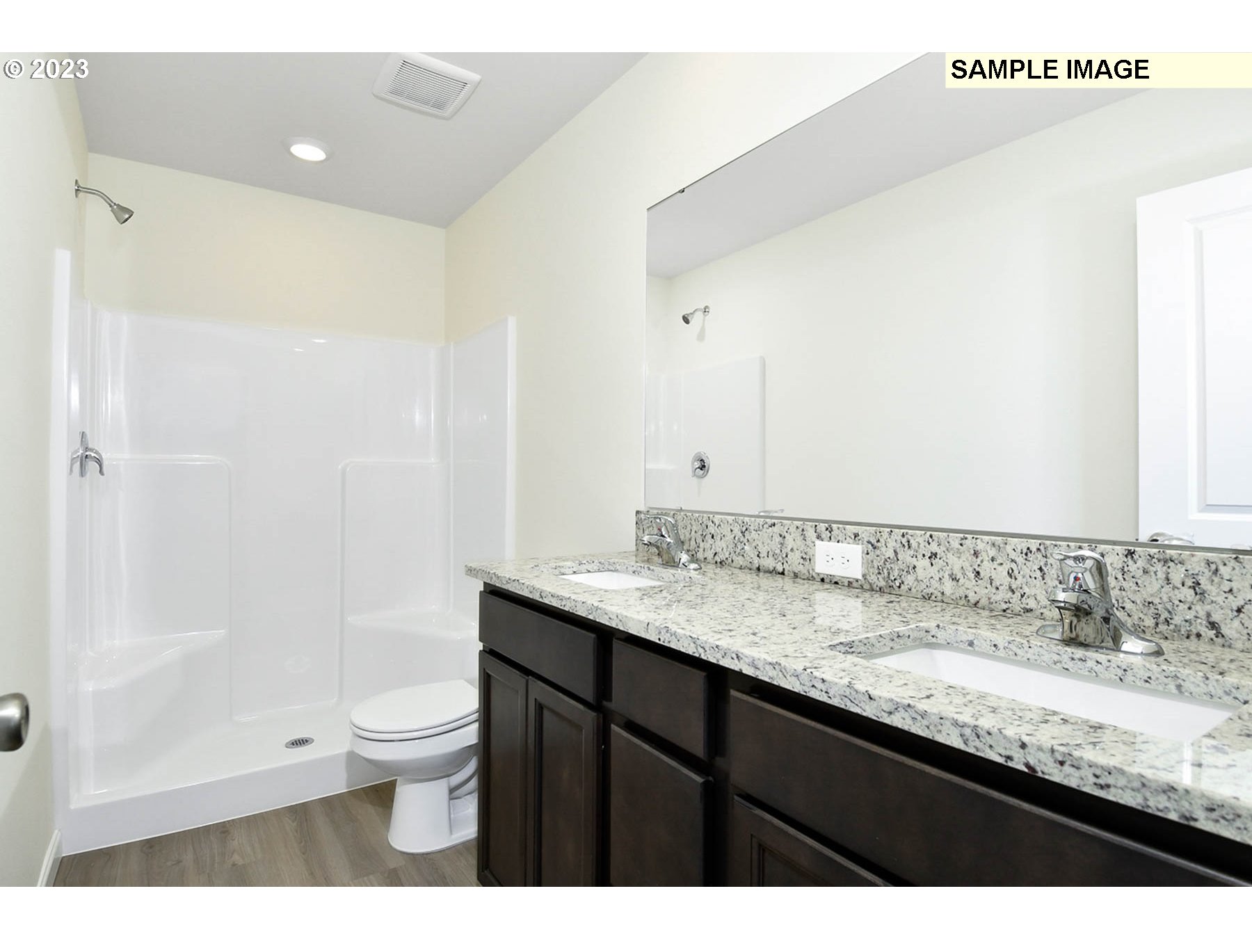3974 Southwest Knapp Drive Gresham, OR 97080 - Photo 4 of 14 a bathroom with a granite countertop sink a toilet and shower