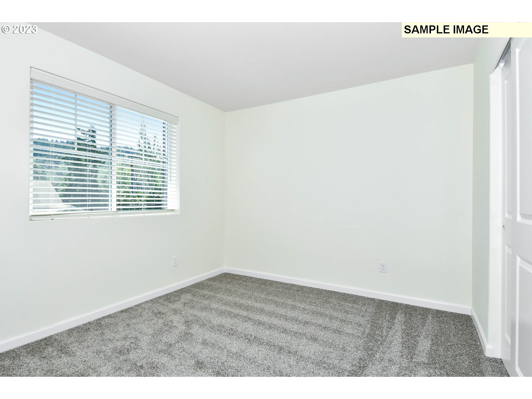 3974 Southwest Knapp Drive Gresham, OR 97080 - Photo 5 of 14 a view of an empty room with wooden floor and a window