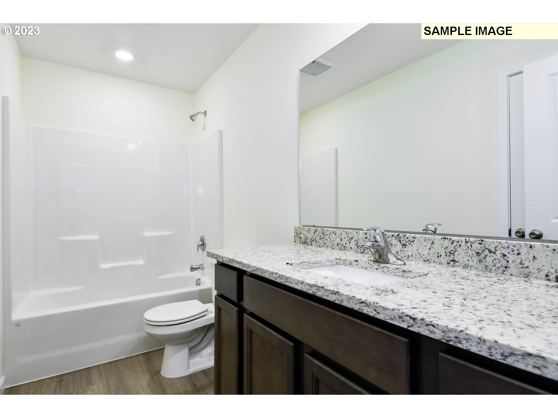 3974 Southwest Knapp Drive Gresham, OR 97080 - Photo 6 of 14 a bathroom with a granite countertop sink a toilet and shower