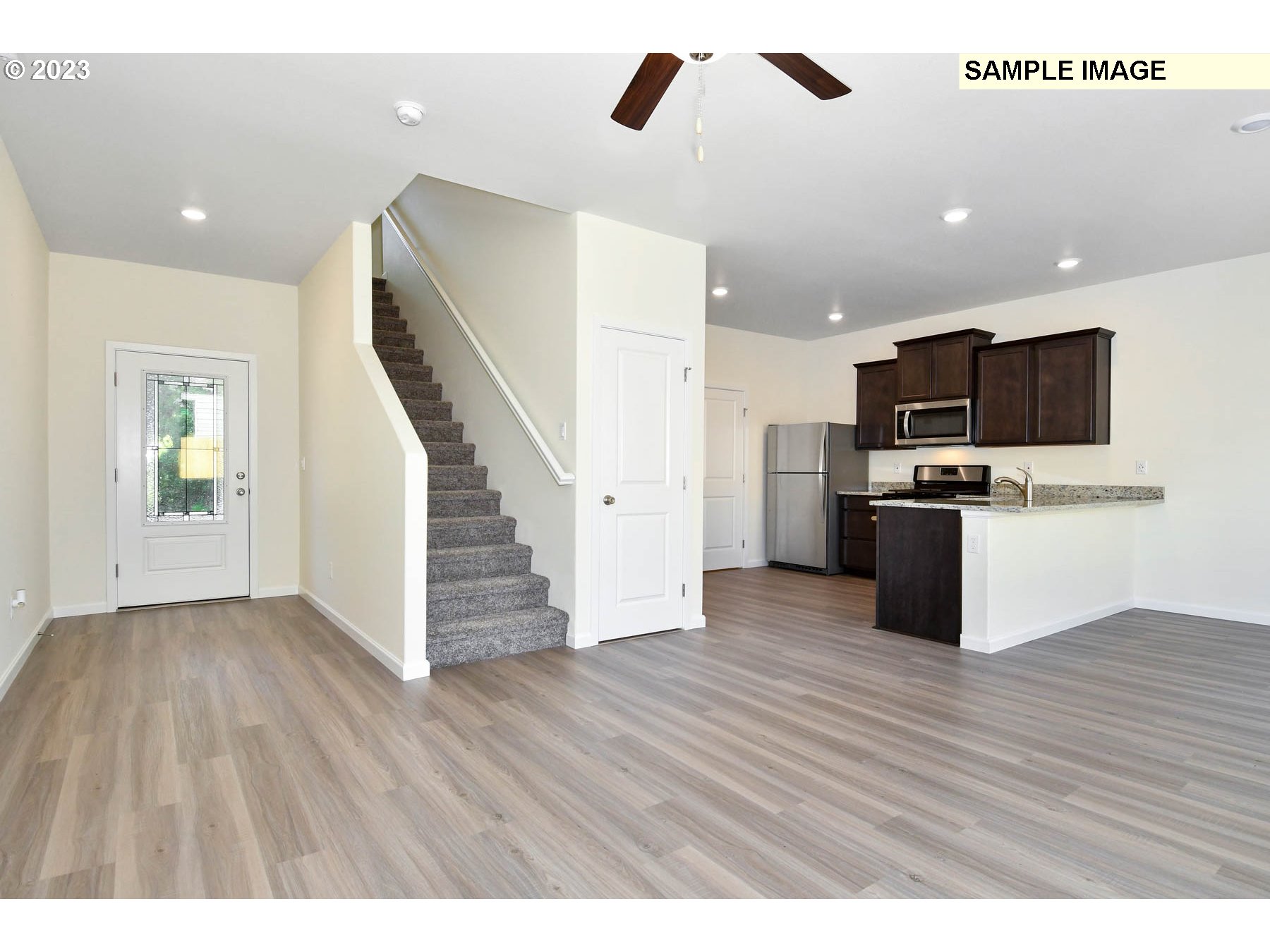 3974 Southwest Knapp Drive Gresham, OR 97080 - Photo 9 of 14 a view of kitchen with microwave and wooden floor