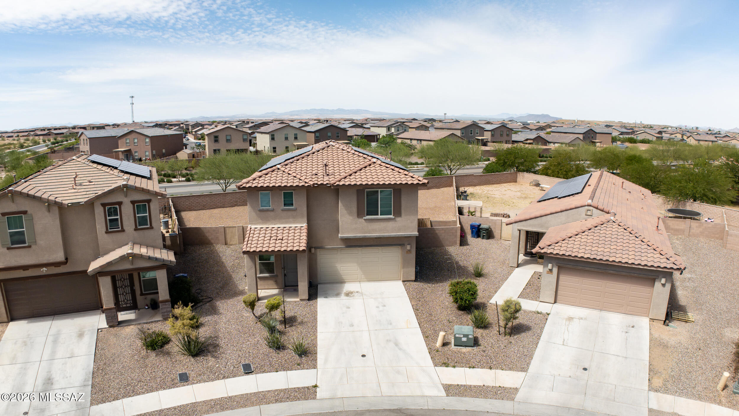 7556 South Circulo Rio Blanco Tucson, AZ 85756 - Photo 2 of 50 So much space to enjoy Arizona living! Beautiful overhead view of this energy-efficient home with solar panels, tile roof and two-car garage!