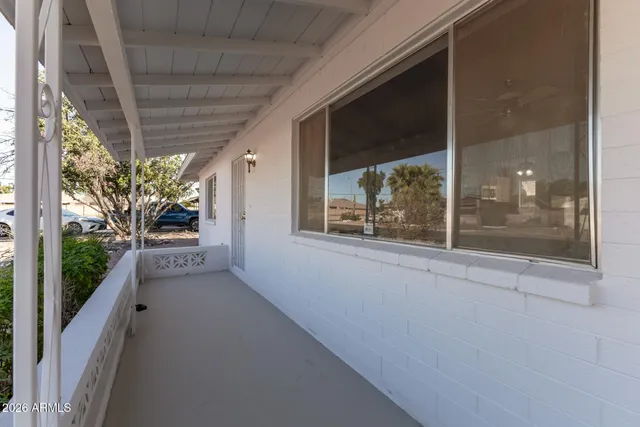 a view of an empty room and wooden floor