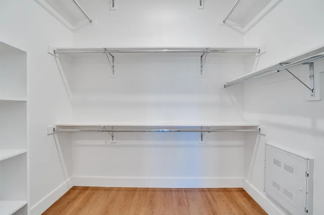 a view of an empty walk in closet