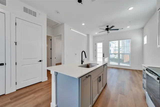 a kitchen that has a lot of cabinets in it