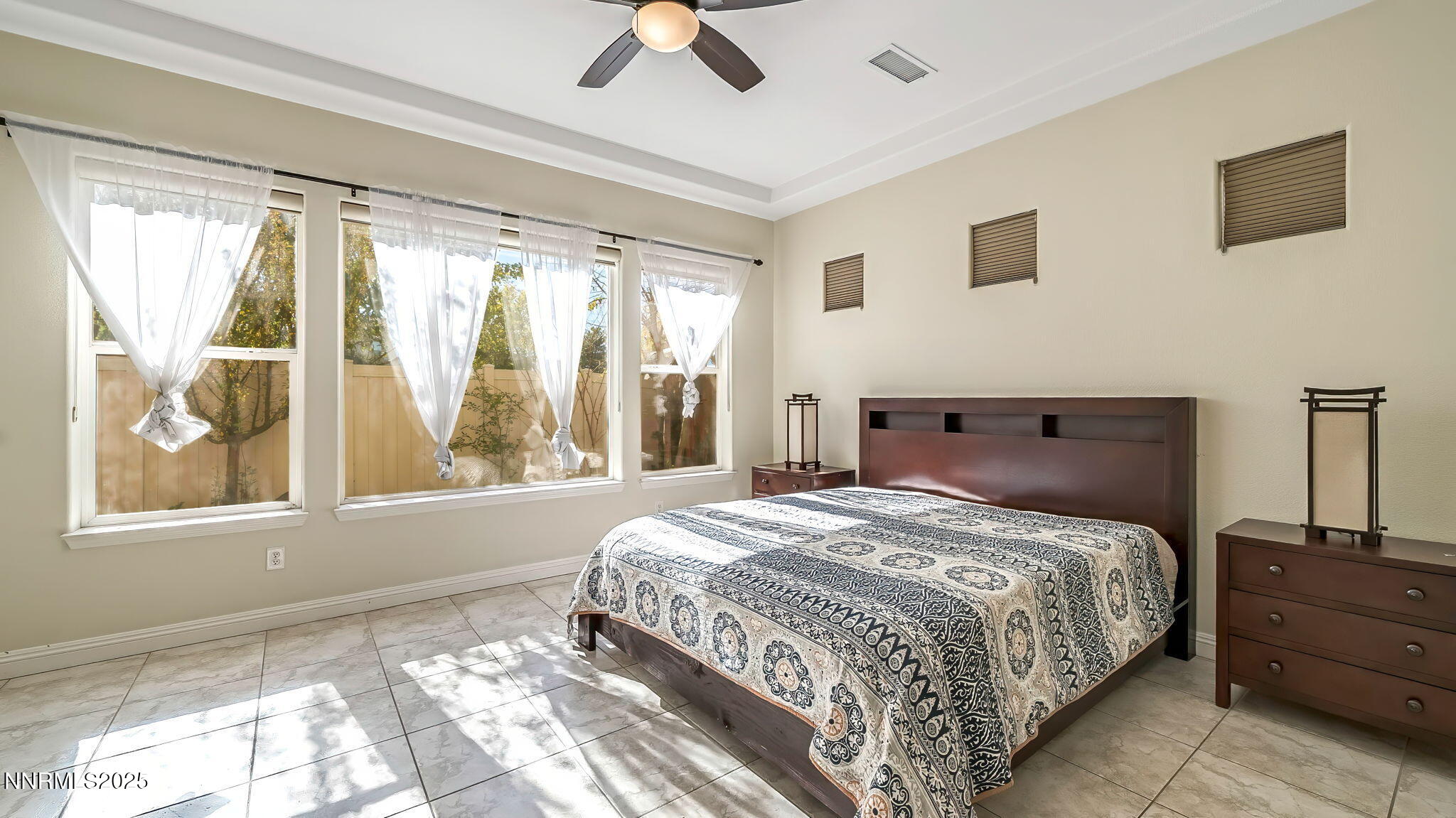 1812 Braemore Drive Reno, NV 89521 - Photo 11 of 26 a bedroom with a large bed and a window