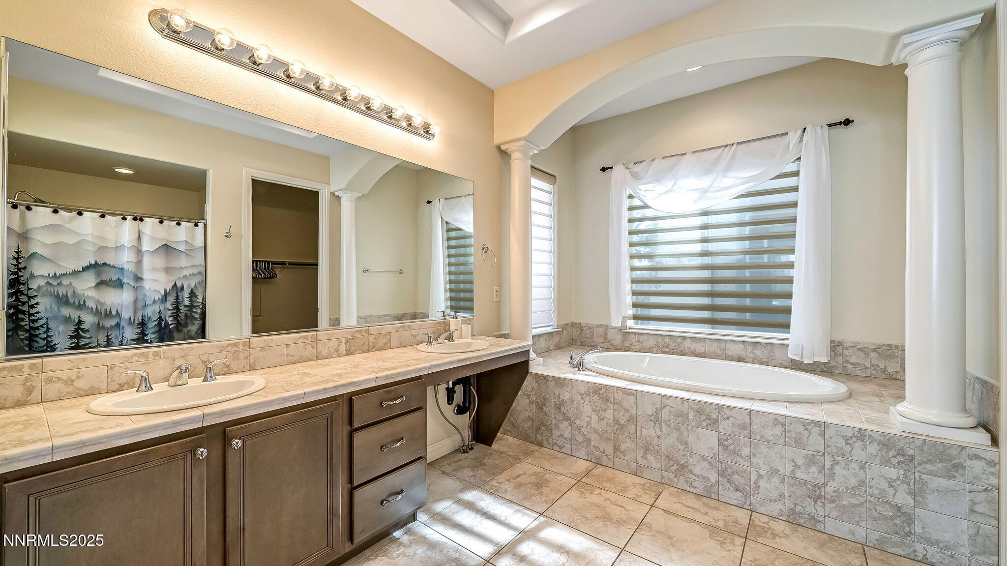 1812 Braemore Drive Reno, NV 89521 - Photo 12 of 26 a spacious bathroom with a granite countertop tub sink and mirror