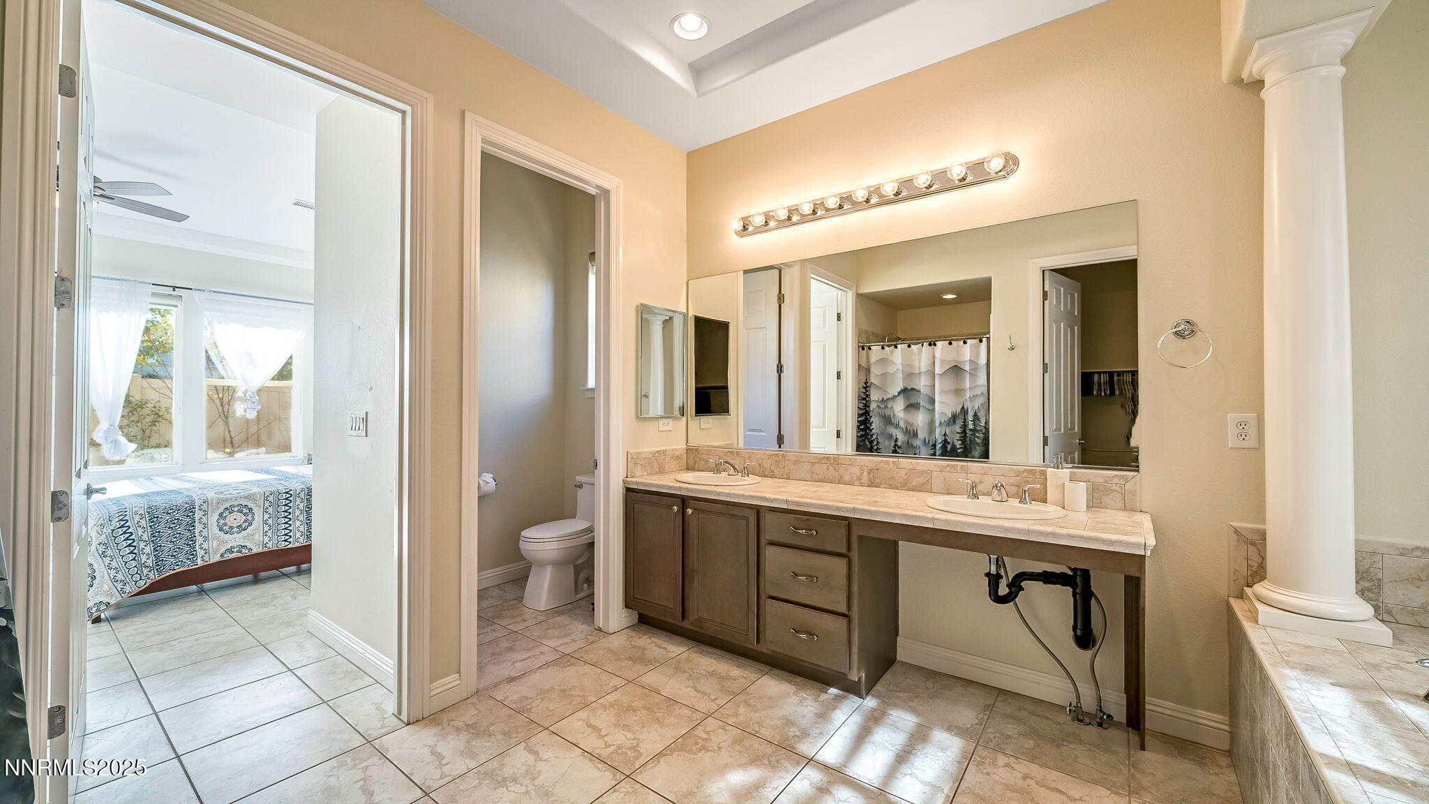 1812 Braemore Drive Reno, NV 89521 - Photo 14 of 26 a spacious bathroom with a granite countertop sink and a mirror