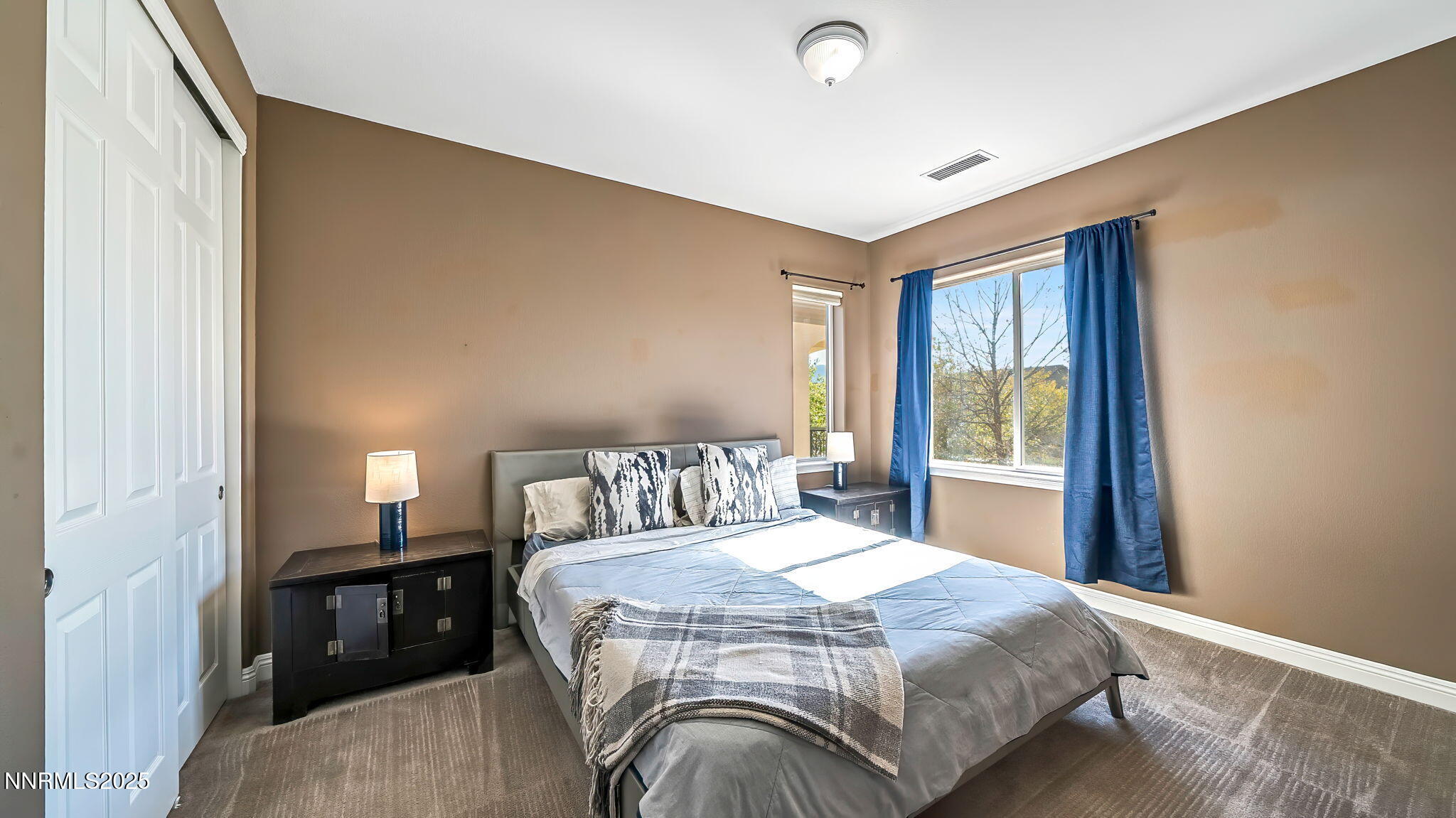 1812 Braemore Drive Reno, NV 89521 - Photo 20 of 26 a bedroom with a bed and a window