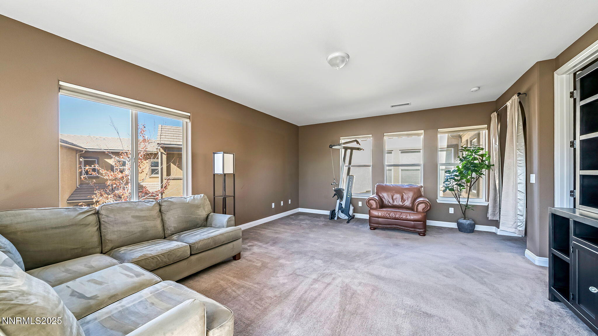 1812 Braemore Drive Reno, NV 89521 - Photo 22 of 26 a living room with furniture and a flat screen tv