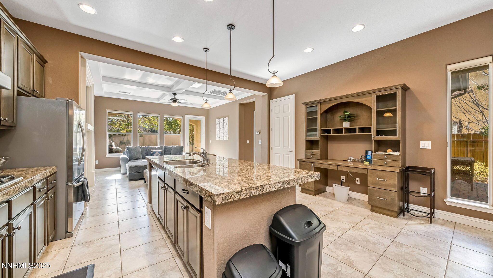 1812 Braemore Drive Reno, NV 89521 - Photo 6 of 26 a open kitchen with stainless steel appliances granite countertop a sink stove and refrigerator