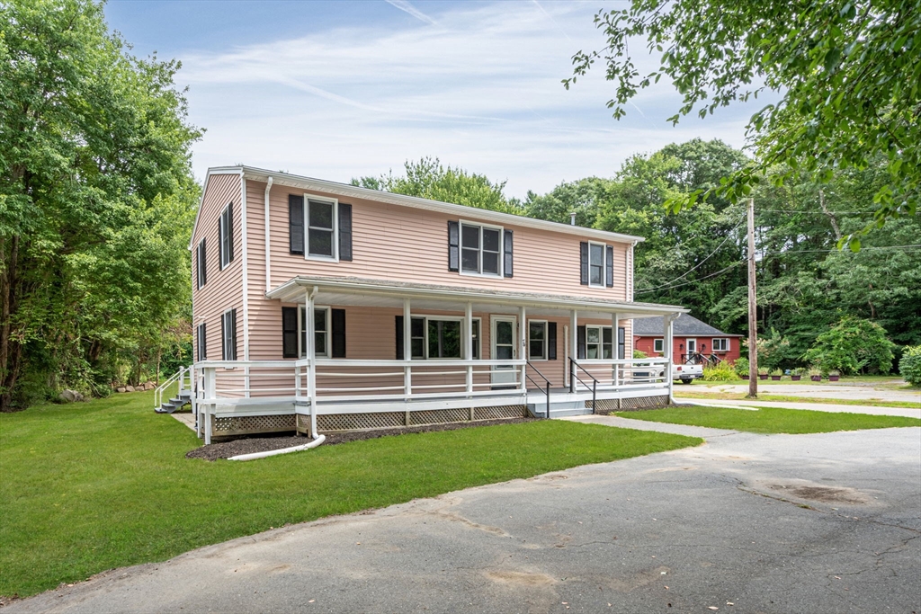 74 County Road East Freetown, MA 02717 - Photo 1 of 40 a front view of a house with a yard and trees