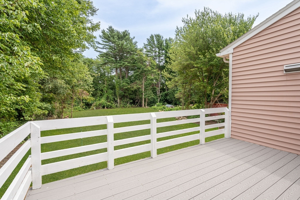 74 County Road East Freetown, MA 02717 - Photo 33 of 40 a view of a white house with a small yard and wooden floor and fence