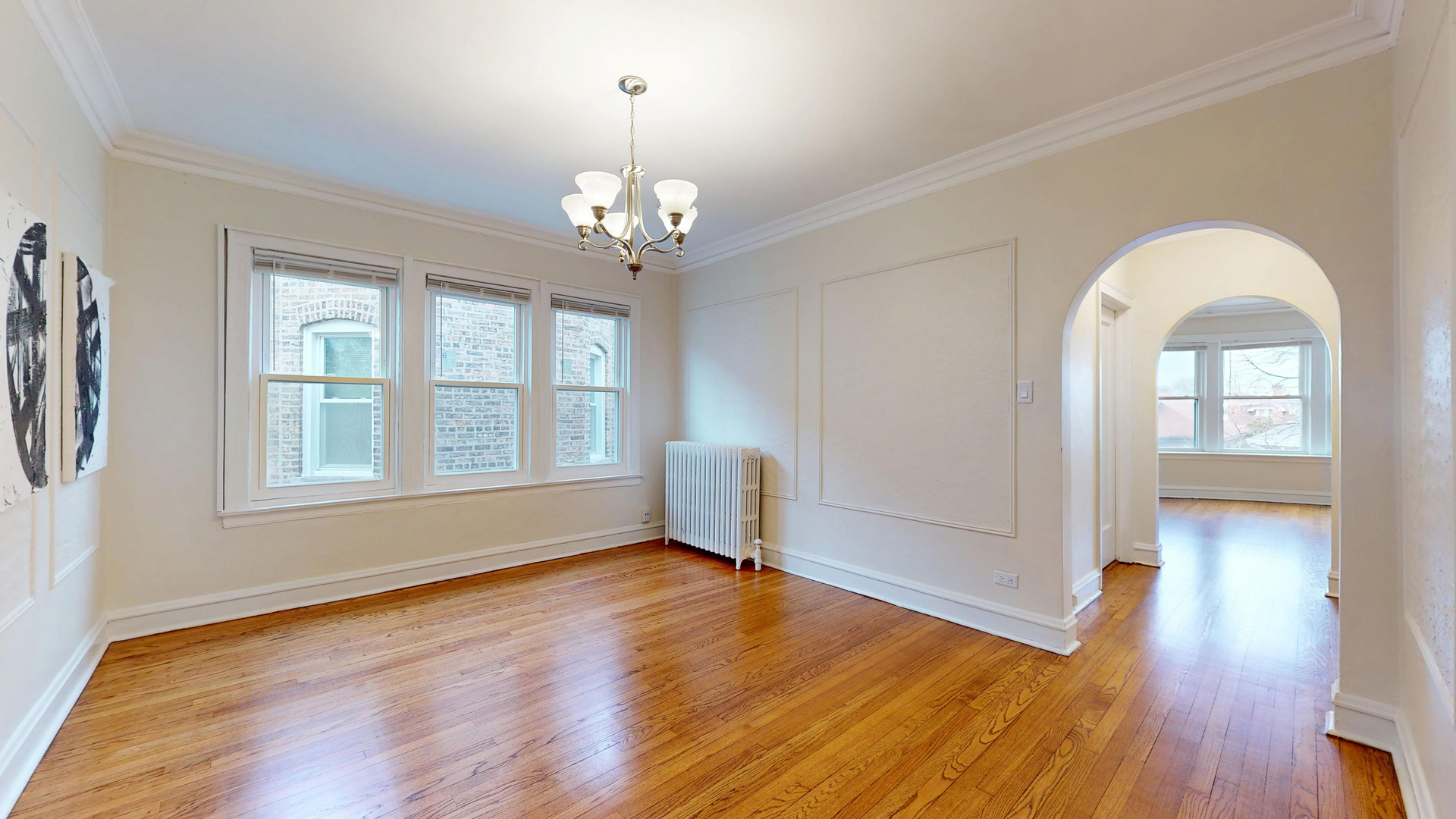 6738 North Rockwell Street, Unit 2 Chicago, IL 60645 - Photo 4 of 13 a view of empty room with wooden floor and fan