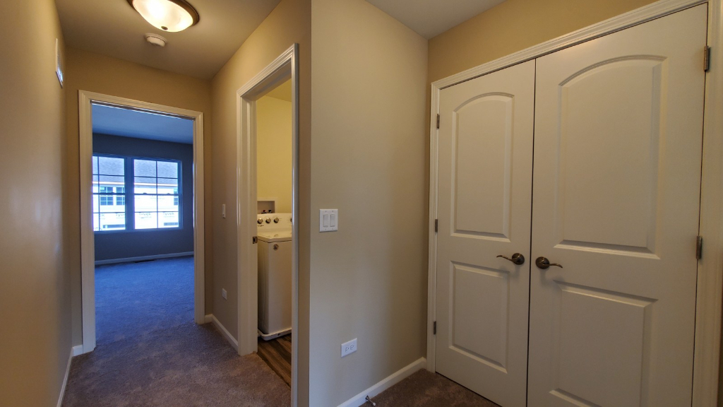249 Timber Ridge Court Joliet, IL 60431 - Photo 16 of 25 a view of a hallway with wooden floor