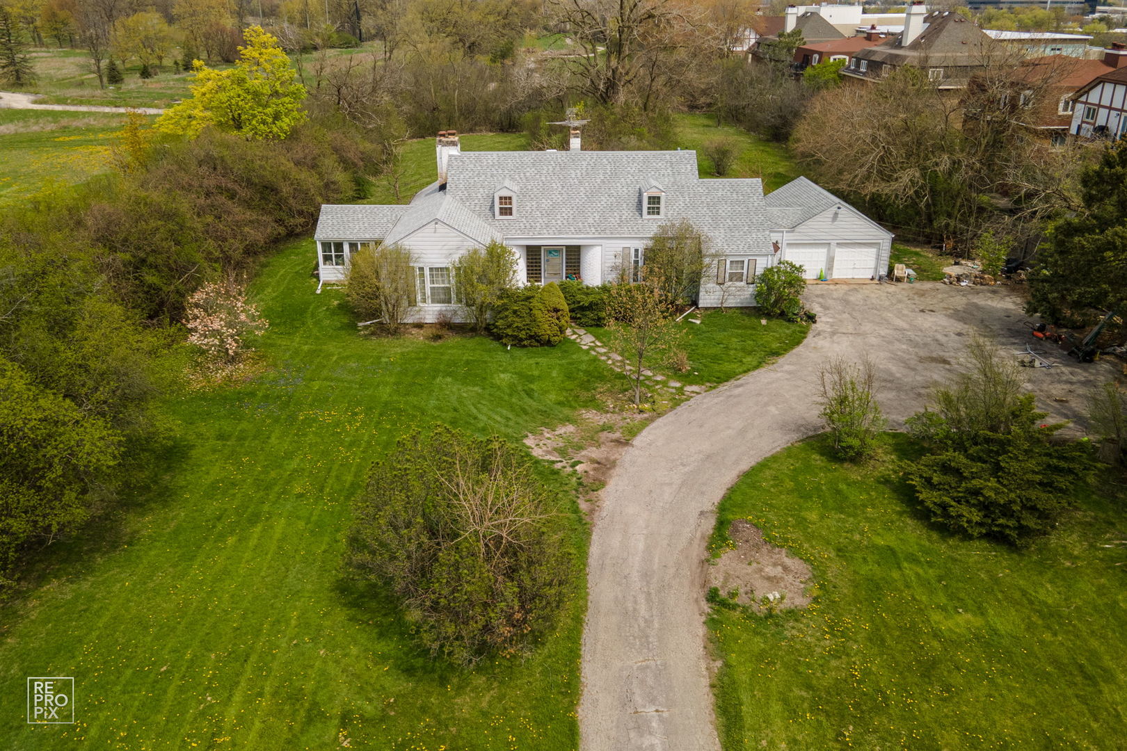 820 Dundee Road Northbrook, IL 60062 - Photo 9 of 12 an aerial view of a house with a yard and lake view