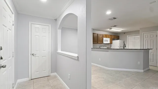 a view of a kitchen from the hallway