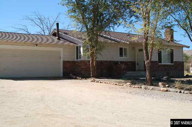 15450 Kivett Lane Reno, NV 89521 - Photo 1 of 9 a view of house with snow on the road