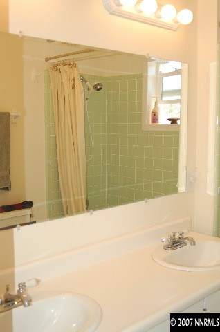 15450 Kivett Lane Reno, NV 89521 - Photo 7 of 9 a bathroom with a sink and a mirror