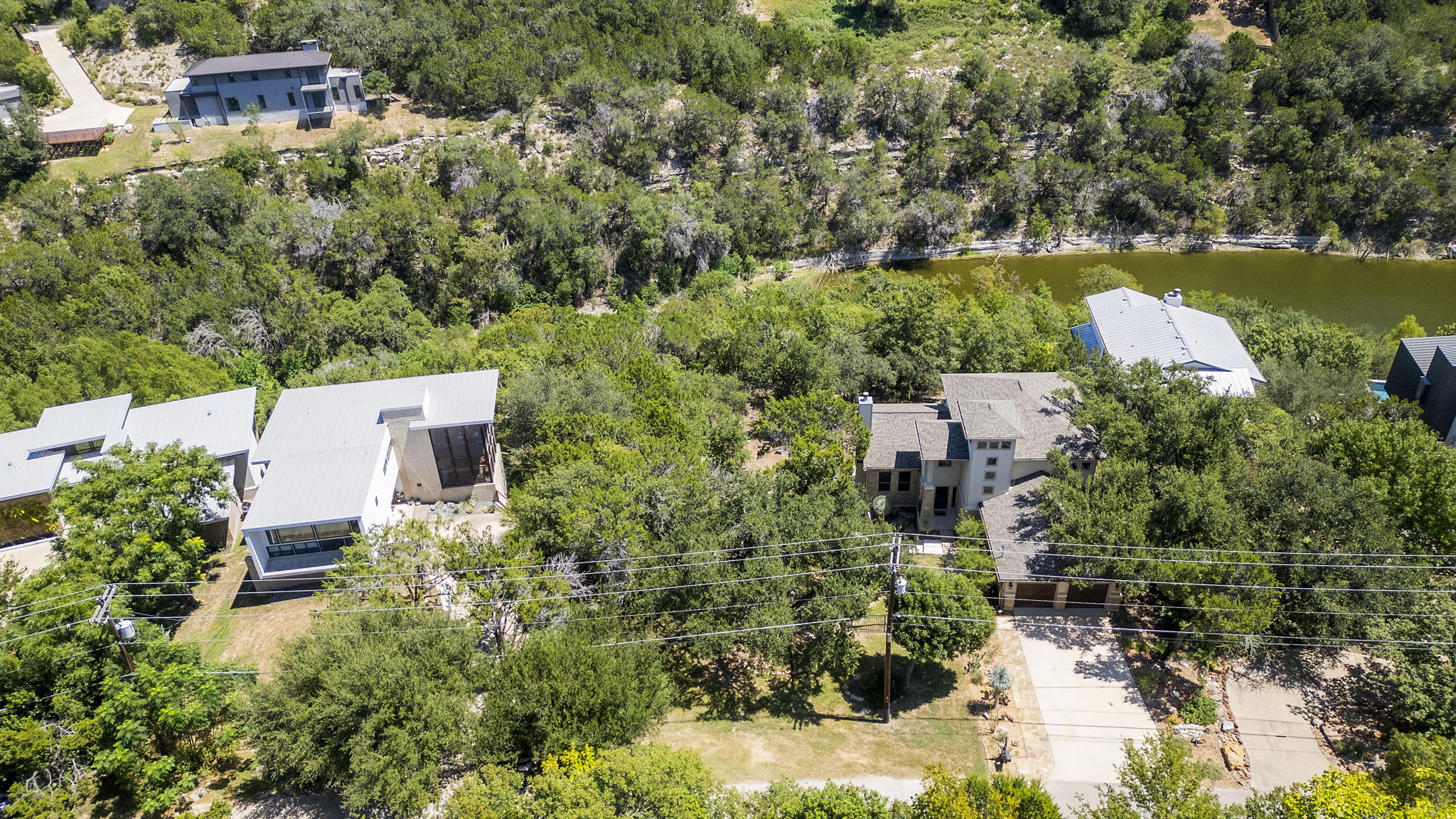 3013 Geronimo Trail Austin, TX 78734 - Photo 3 of 20 an aerial view of a house with a garden and lake view