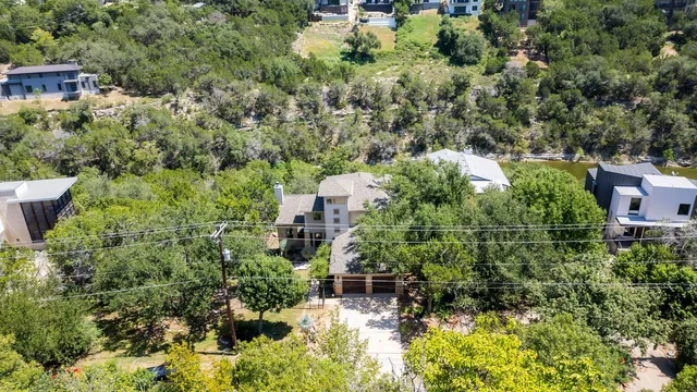 an aerial view of house with yard