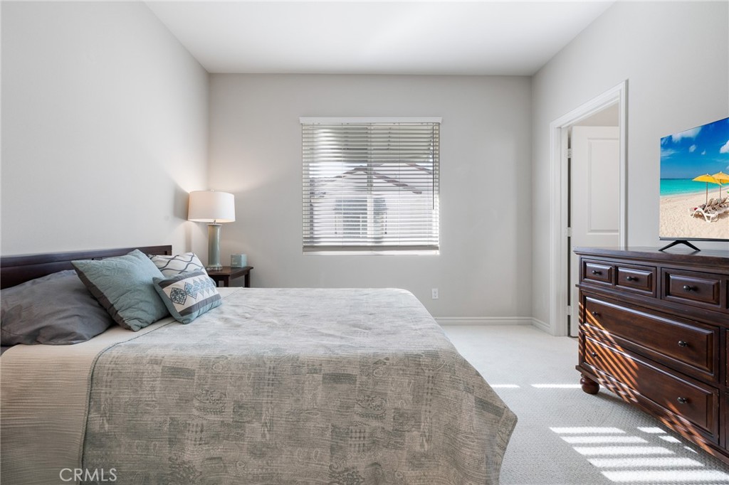 1200 Oliva Court Duarte, CA 91010 - Photo 19 of 40 a bedroom with a bed and a dresser with wooden floor