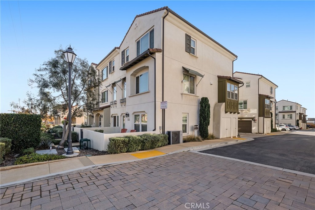 1200 Oliva Court Duarte, CA 91010 - Photo 2 of 40 a view of a white building among the street with palm trees