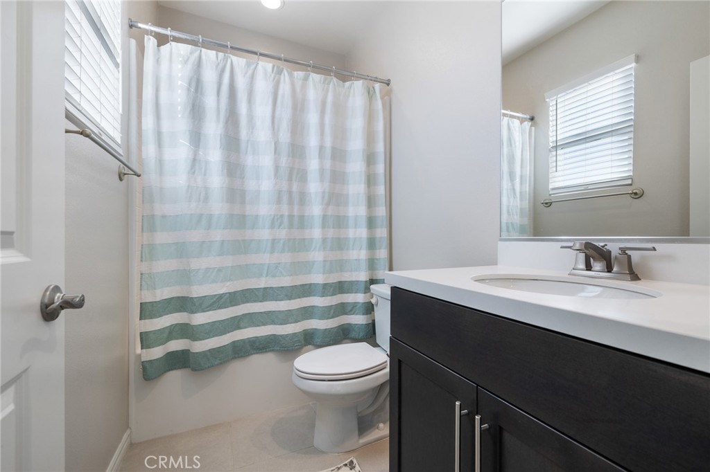 1200 Oliva Court Duarte, CA 91010 - Photo 21 of 40 a bathroom with a sink a toilet a mirror and shower